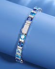 Bracelet de tennis en moissanite et pierres bleu océan